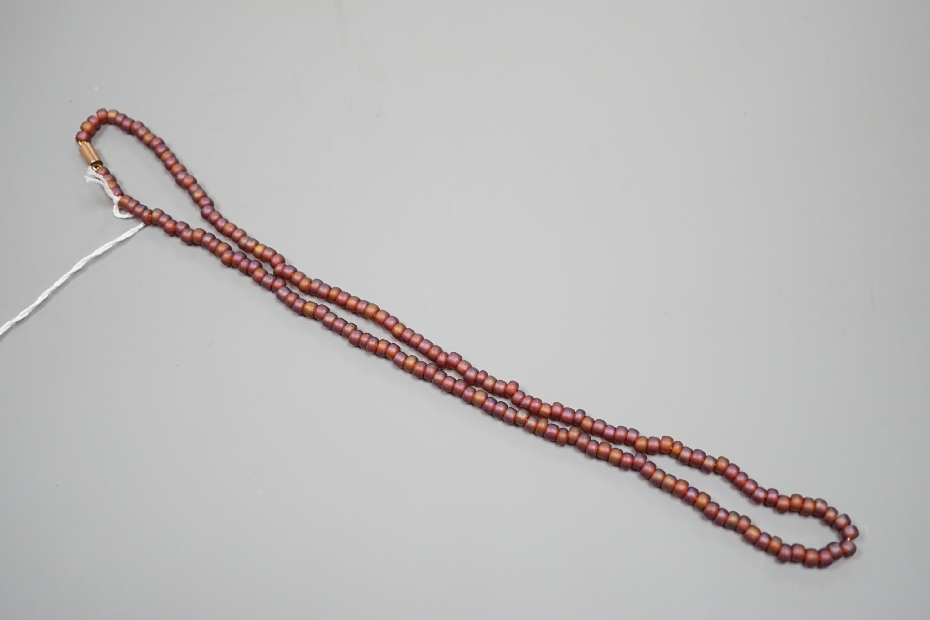 A single strand iridescent art glass bead necklace, with yellow metal clasp, 56cm.